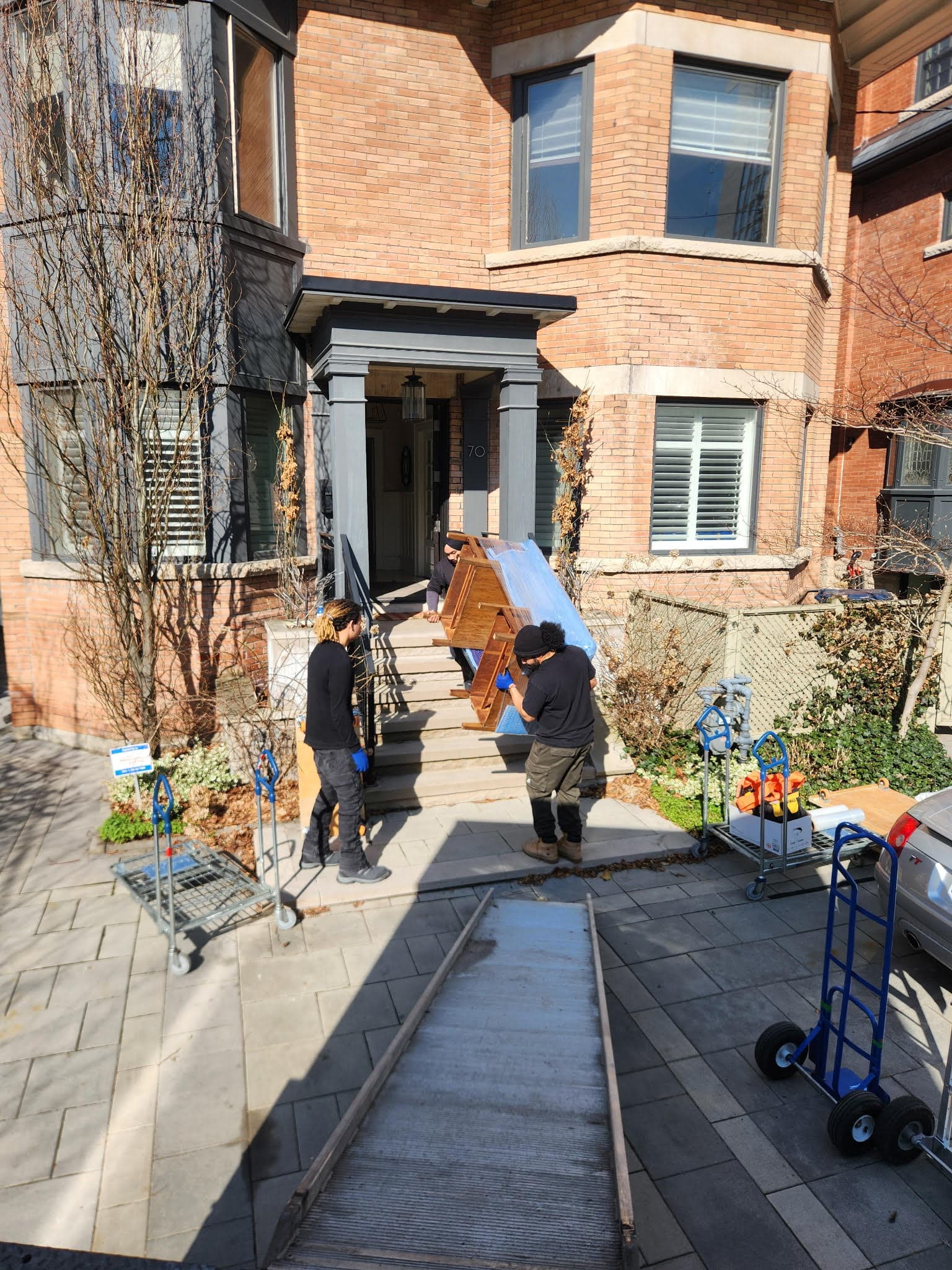 Team carrying furniture